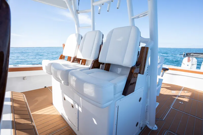  Yacht Photos Pics Freeman 47 boat 2022 model with white cushioned seats on deck.