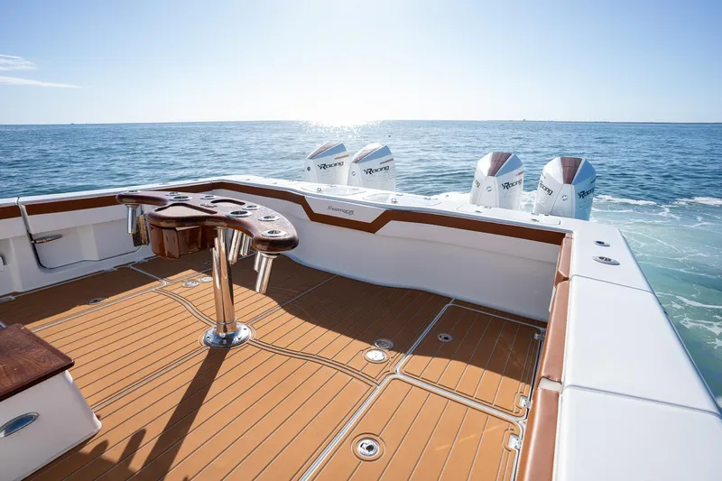  Yacht Photos Pics Freeman 47 boat deck with quad outboard engines, 2022 model, on open water.