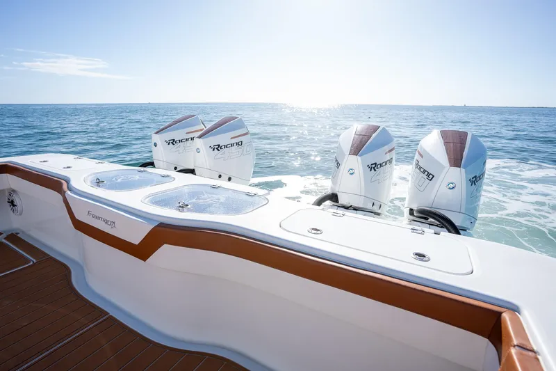  Yacht Photos Pics Freeman 47 boat with four powerful outboard engines on the open sea, 2022 model.