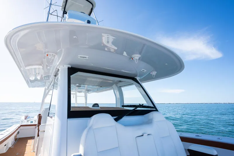  Yacht Photos Pics Freeman 47 boat, 2022 model, cruising on calm blue waters under a clear sky.