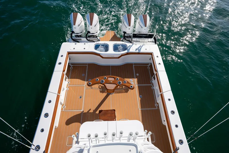  Yacht Photos Pics Freeman 47 boat 2022 model with quad engines and spacious deck on water.