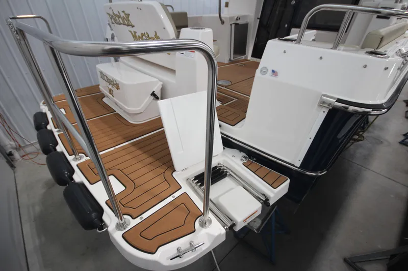 Patrick Mcginty Yacht Photos Pics 2022 Ranger Tugs R-29 Sedan Luxury Edition boat deck with teak flooring and stainless steel railings.
