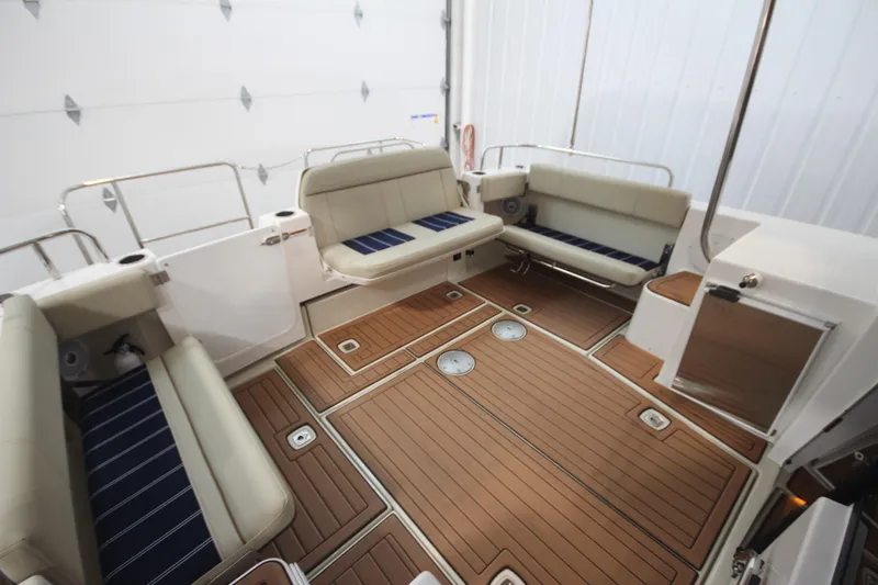 Patrick Mcginty Yacht Photos Pics 2022 Ranger Tugs R-29 Sedan Luxury Edition interior with elegant seating and teak flooring.