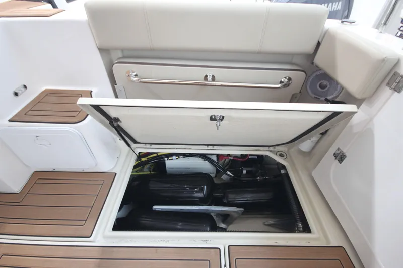 Patrick Mcginty Yacht Photos Pics 2022 Ranger Tugs R-29 Sedan Luxury Edition engine compartment with open hatch and teak flooring.