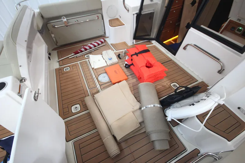 Patrick Mcginty Yacht Photos Pics 2022 Ranger Tugs R-29 Sedan Luxury Edition boat deck with safety equipment and accessories.