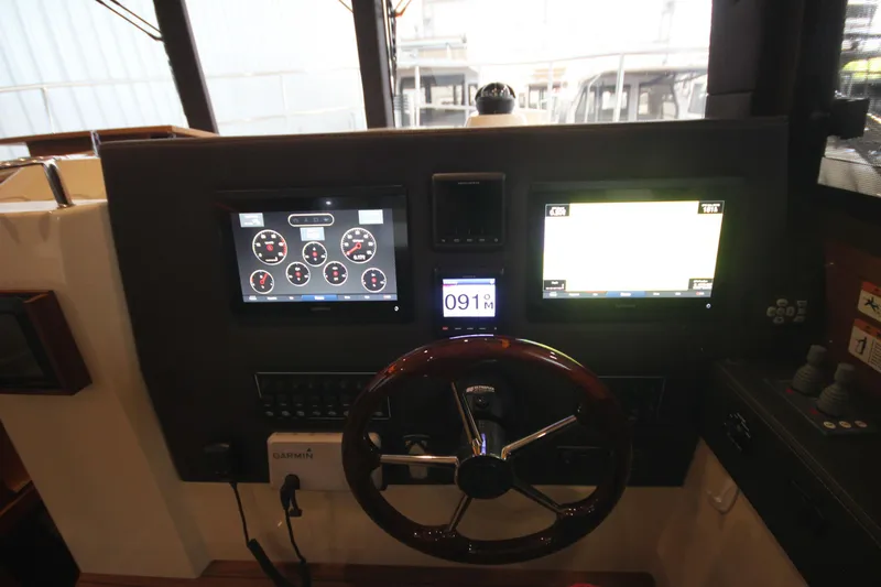 Patrick Mcginty Yacht Photos Pics Helm of 2022 Ranger Tugs R-29 Sedan Luxury Edition with navigation displays and controls.