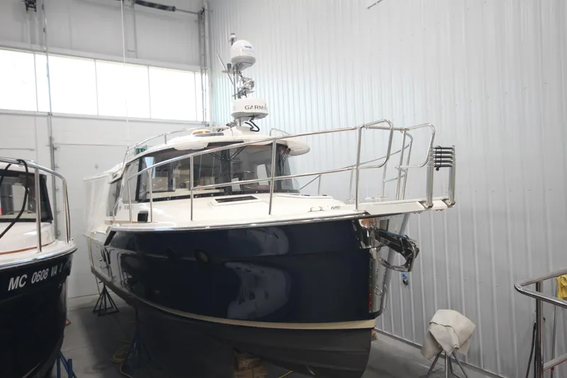 Patrick Mcginty Yacht Photos Pics 2022 Ranger Tugs R-29 Sedan Luxury Edition in indoor storage facility.