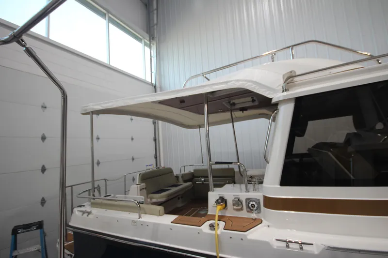 Patrick Mcginty Yacht Photos Pics 2022 Ranger Tugs R-29 Sedan Luxury Edition in a garage, showcasing the rear deck area.