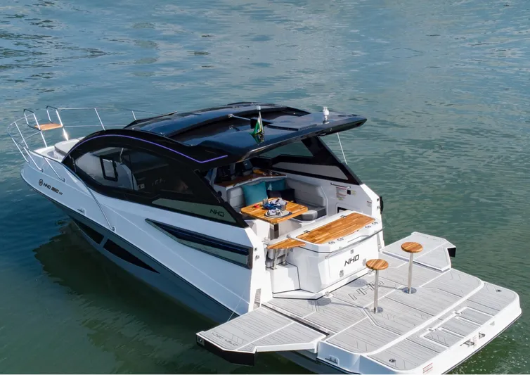  Yacht Photos Pics Modern 2025 NHD 365 Open Deck HT yacht on water, featuring sleek design and spacious deck.