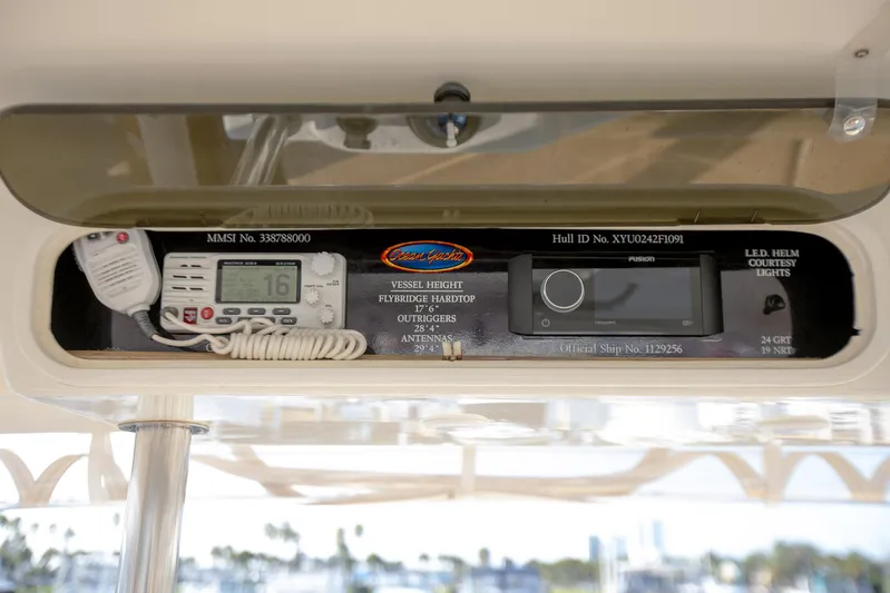 Scallywag Yacht Photos Pics 1991 Ocean Yachts 42 Super Sport control panel with radio and navigation equipment.