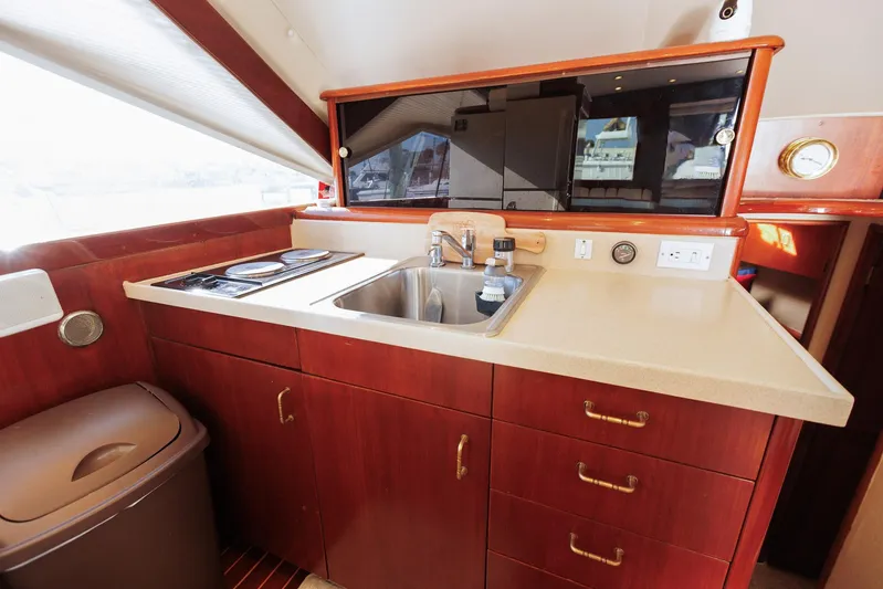 Scallywag Yacht Photos Pics Interior of 1991 Ocean Yachts 42 Super Sport, featuring a compact kitchen area.