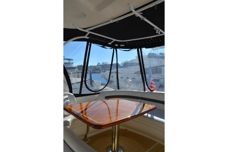 Knot On Call Yacht Photos Pics Interior view of 2007 Sea Ray 44 Sundancer yacht with polished wooden table.