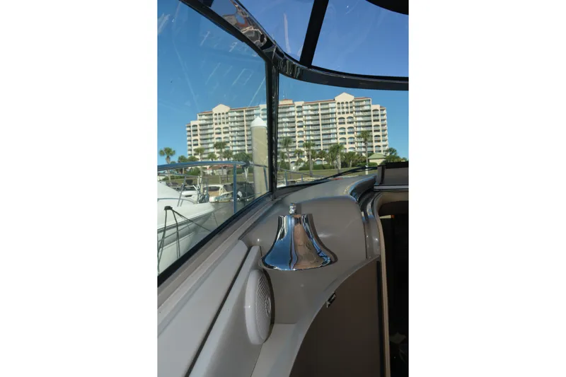 Knot On Call Yacht Photos Pics 2007 Sea Ray 44 Sundancer interior with marina view and modern architecture in background.