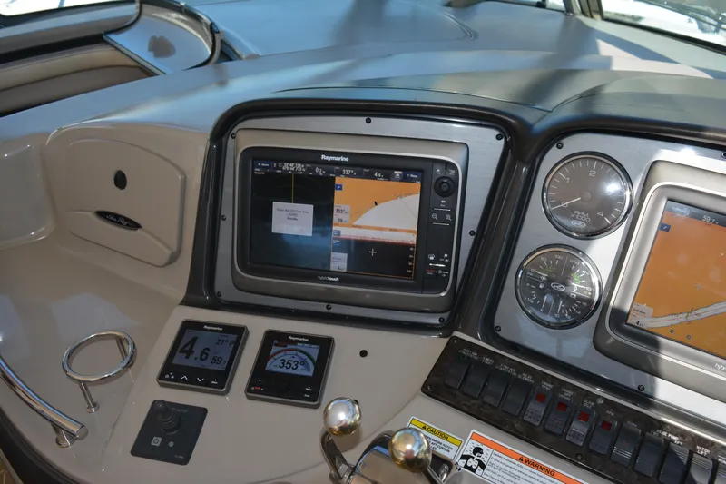 Knot On Call Yacht Photos Pics 2007 Sea Ray 44 Sundancer helm with navigation screens and gauges.