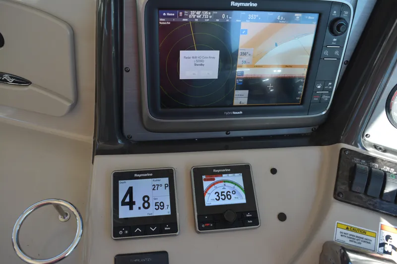 Knot On Call Yacht Photos Pics Control panel of a 2007 Sea Ray 44 Sundancer with Raymarine navigation displays.