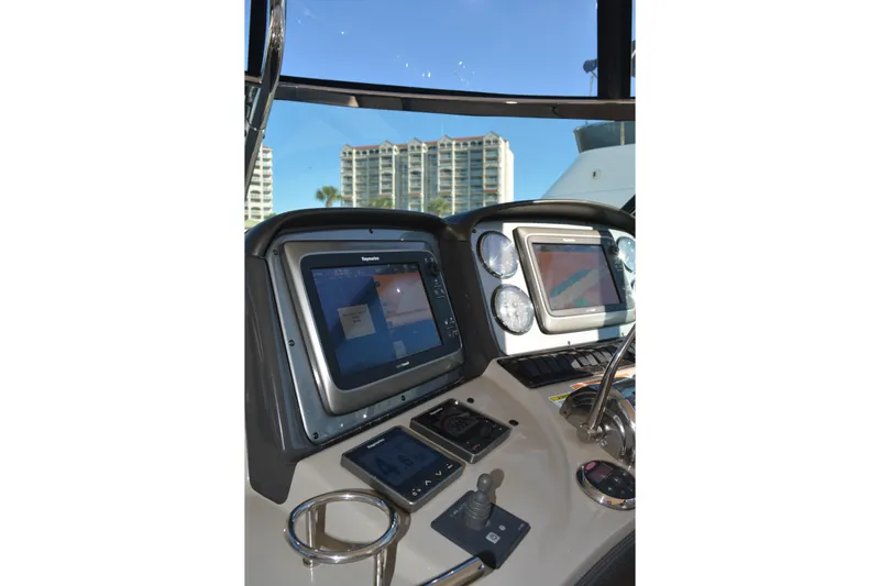 Knot On Call Yacht Photos Pics Control panel of a 2007 Sea Ray 44 Sundancer yacht with navigation screens and controls.