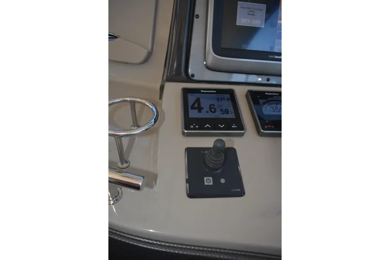 Knot On Call Yacht Photos Pics Control panel of 2007 Sea Ray 44 Sundancer with navigation displays and joystick.