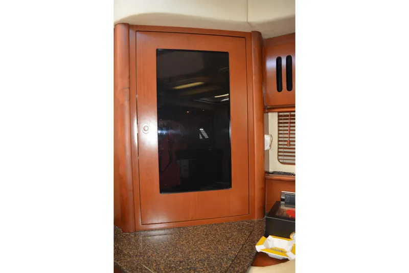 Knot On Call Yacht Photos Pics 2007 Sea Ray 44 Sundancer interior with wooden cabinet and countertop.
