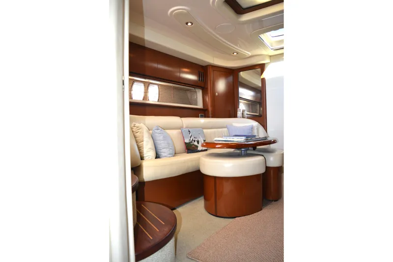 Knot On Call Yacht Photos Pics Luxurious interior of 2007 Sea Ray 44 Sundancer yacht with elegant seating and table.