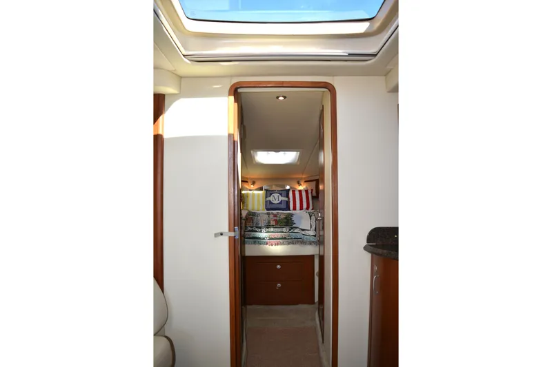 Knot On Call Yacht Photos Pics Interior view of 2007 Sea Ray 44 Sundancer yacht cabin with skylight and cozy decor.