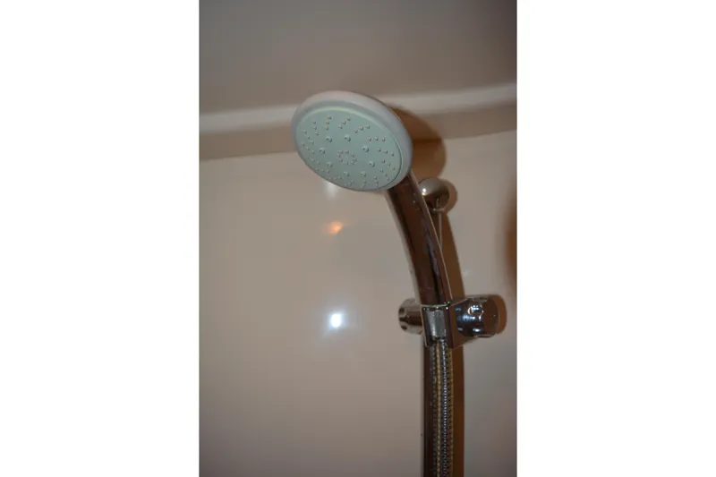 Knot On Call Yacht Photos Pics Shower head in 2007 Sea Ray 44 Sundancer yacht bathroom.