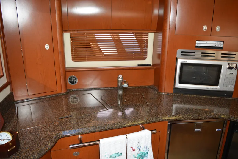 Knot On Call Yacht Photos Pics 2007 Sea Ray 44 Sundancer yacht kitchen with granite countertops and modern appliances.