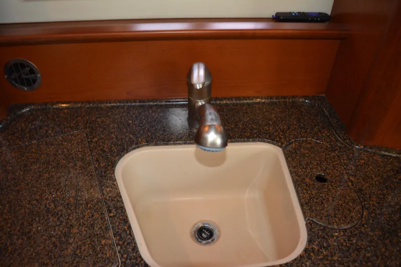Knot On Call Yacht Photos Pics Kitchen sink and faucet in 2007 Sea Ray 44 Sundancer yacht interior.