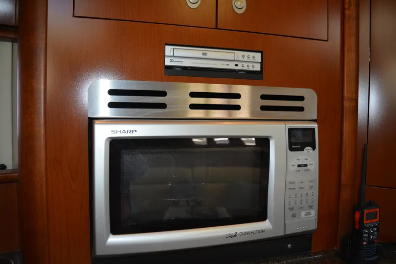 Knot On Call Yacht Photos Pics 2007 Sea Ray 44 Sundancer kitchen with Sharp microwave and DVD player.