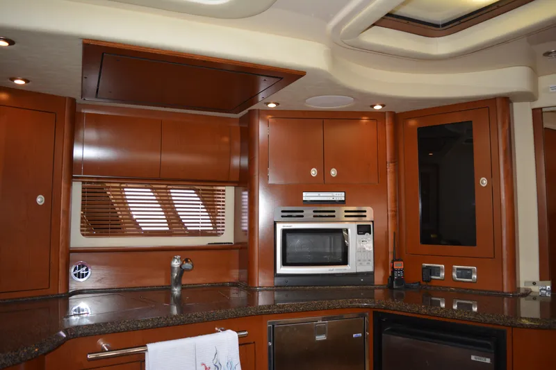 Knot On Call Yacht Photos Pics Luxurious kitchen interior of 2007 Sea Ray 44 Sundancer yacht with modern appliances.