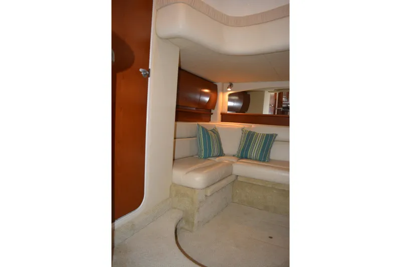 Knot On Call Yacht Photos Pics Interior of 2007 Sea Ray 44 Sundancer yacht with cozy seating and striped cushions.