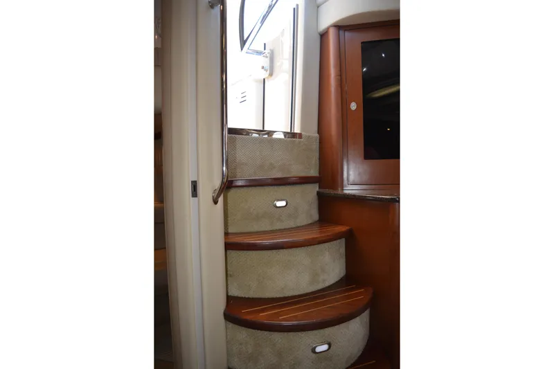 Knot On Call Yacht Photos Pics Staircase inside 2007 Sea Ray 44 Sundancer yacht with wooden steps and handrail.
