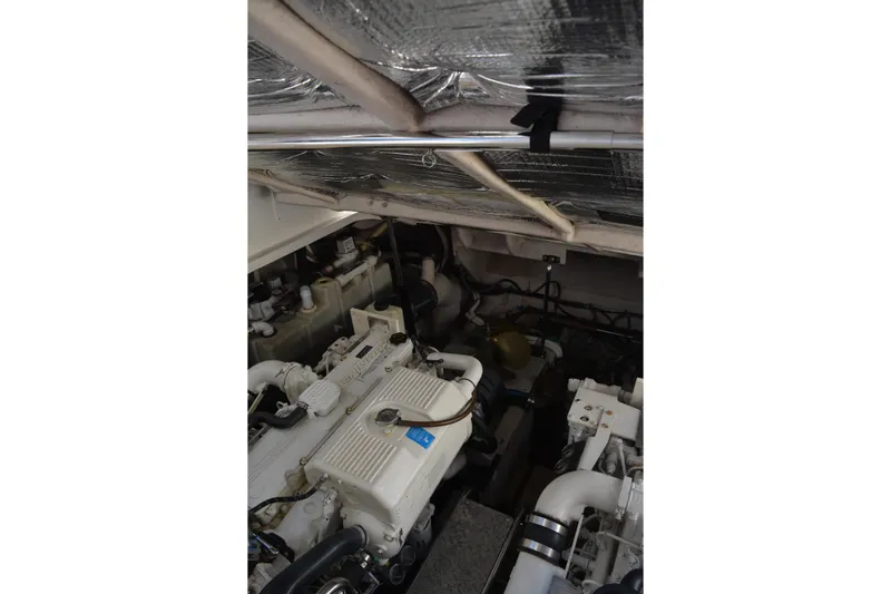 Knot On Call Yacht Photos Pics Engine compartment of 2007 Sea Ray 44 Sundancer, showcasing mechanical components and insulation.