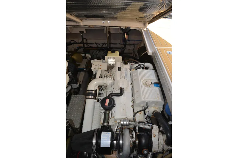 Knot On Call Yacht Photos Pics Engine compartment of a 2007 Sea Ray 44 Sundancer boat, showcasing mechanical components.