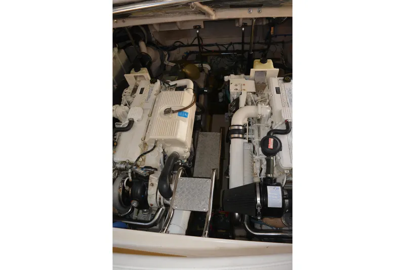 Knot On Call Yacht Photos Pics Engine room of 2007 Sea Ray 44 Sundancer yacht, showcasing dual engines.