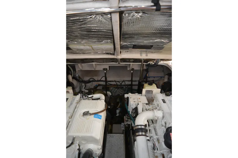 Knot On Call Yacht Photos Pics Engine room of 2007 Sea Ray 44 Sundancer, showcasing dual engines and mechanical components.