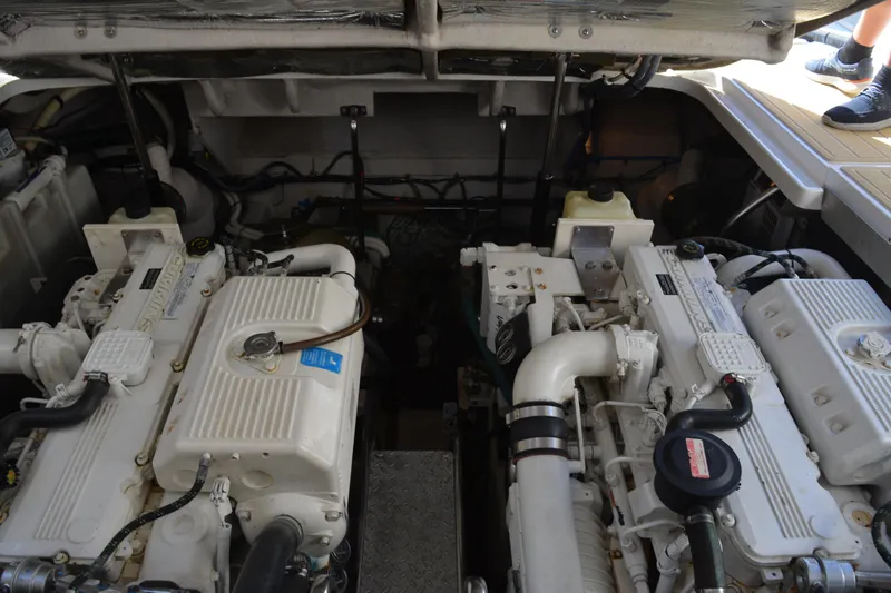 Knot On Call Yacht Photos Pics Engine room of a 2007 Sea Ray 44 Sundancer yacht, showcasing dual engines.