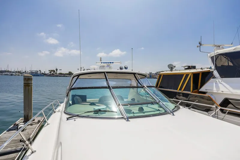  Yacht Photos Pics Sea Ray 510 Sundancer 2000 yacht docked at marina under clear blue sky.