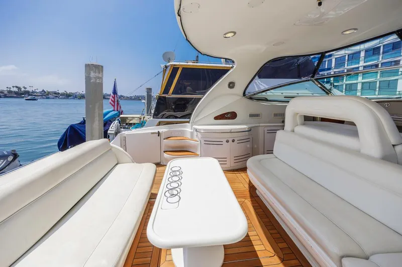  Yacht Photos Pics Luxurious 2000 Sea Ray 510 Sundancer yacht interior with white seating and wooden deck.
