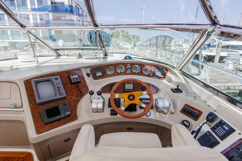  Yacht Photos Pics Cockpit of 2000 Sea Ray 510 Sundancer yacht with navigation instruments and steering wheel.