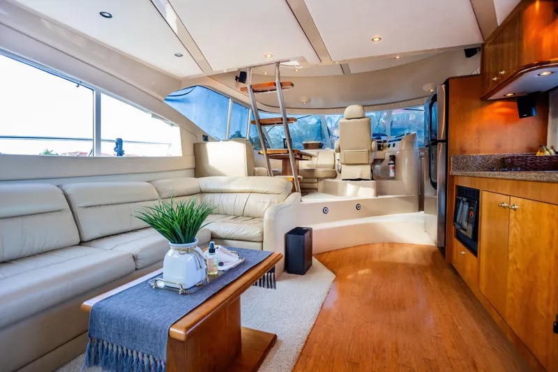  Yacht Photos Pics Luxurious interior of 2001 Cruisers Yachts 5000 Sedan Sport with elegant seating and modern amenities.