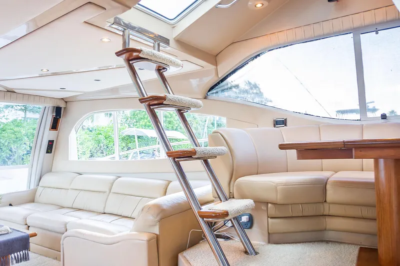  Yacht Photos Pics Luxurious interior of 2001 Cruisers Yachts 5000 Sedan Sport with plush seating and elegant design.