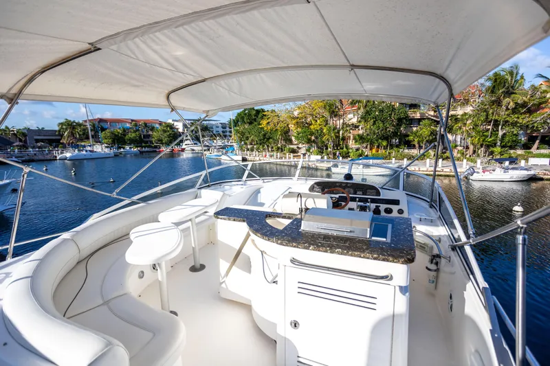  Yacht Photos Pics Luxurious 2001 Cruisers Yachts 5000 Sedan Sport with spacious deck and scenic marina view.