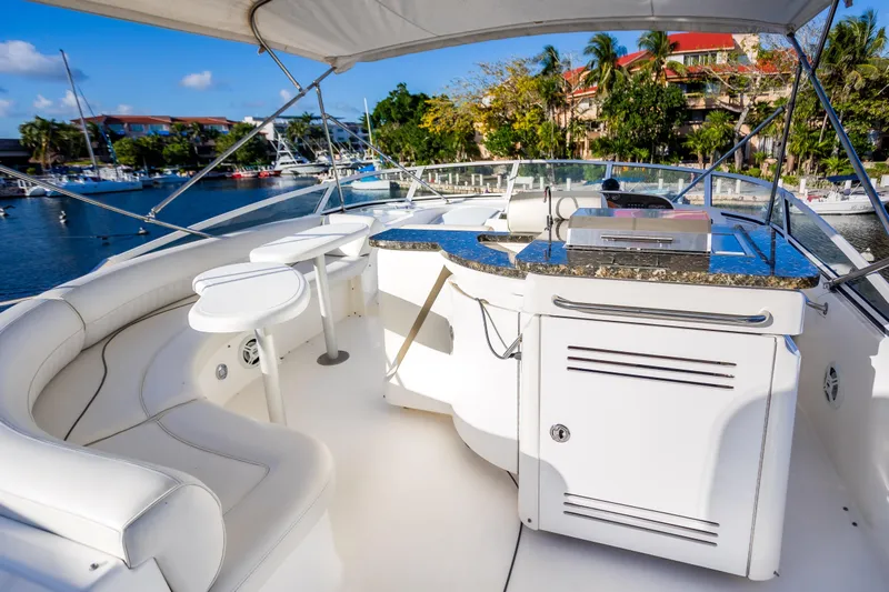  Yacht Photos Pics Luxurious 2001 Cruisers Yachts 5000 Sedan Sport with elegant seating and outdoor kitchen.