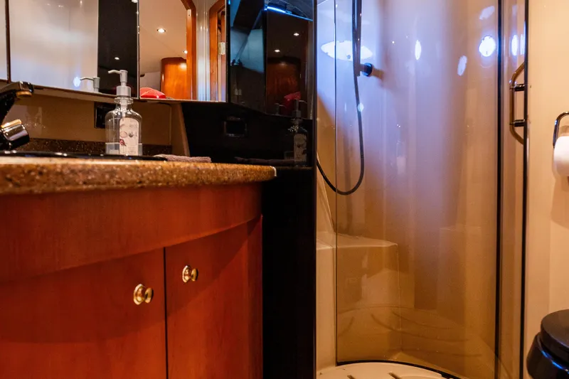  Yacht Photos Pics Luxurious bathroom in 2001 Cruisers Yachts 5000 Sedan Sport with modern fixtures.