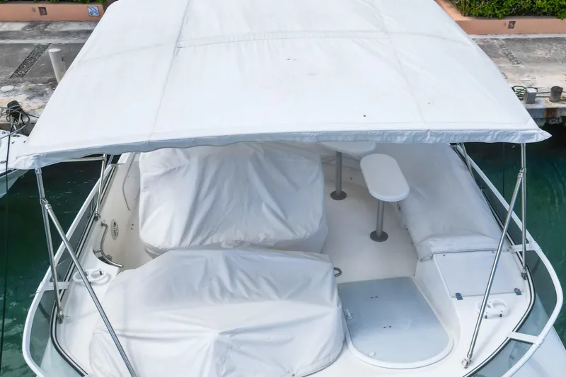  Yacht Photos Pics 2001 Cruisers Yachts 5000 Sedan Sport with covered seating area and canopy.