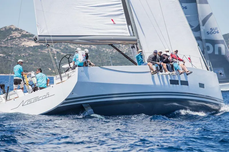 Nausicaä Yacht Photos Pics Sailing on a 2019 Solaris Yachts 55 with crew, navigating clear blue waters.