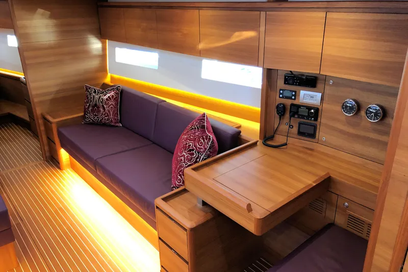 Nausicaä Yacht Photos Pics Luxurious interior of 2019 Solaris Yachts 55 with wooden finish and plush seating.