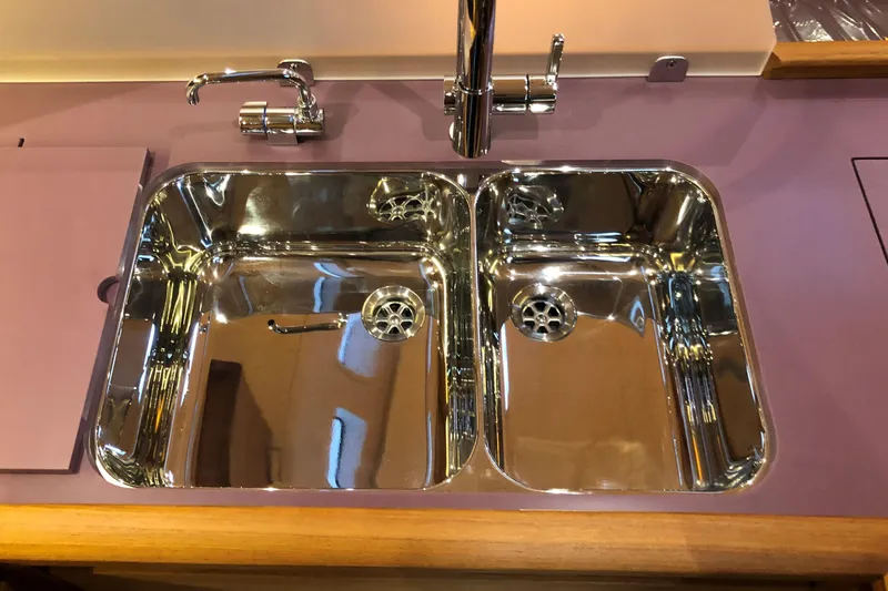 Nausicaä Yacht Photos Pics Stainless steel double sink on Solaris Yachts 55, 2019 model, with modern fixtures.