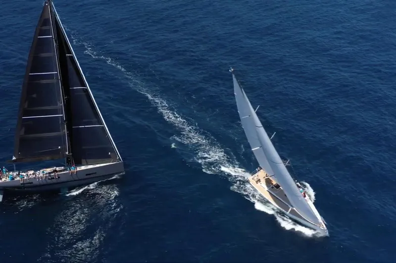 Nausicaä Yacht Photos Pics Aerial view of two Solaris Yachts 55 sailing on open blue sea, 2019 model.