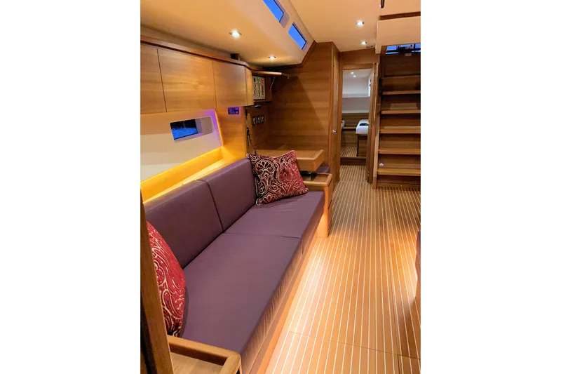 Nausicaä Yacht Photos Pics Luxurious interior of 2019 Solaris Yachts 55 with elegant wood finish and cozy seating.